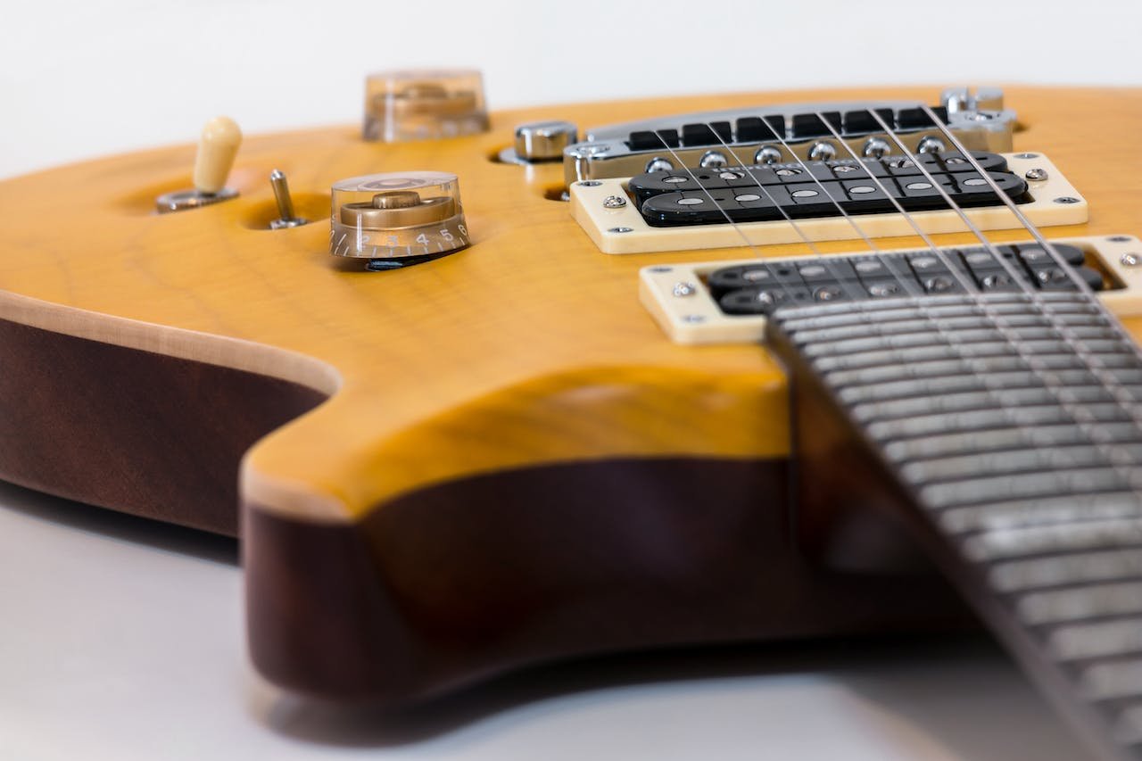 A close up of humbucker pickups on a PRS-style guitar