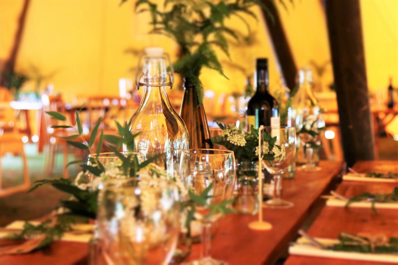 A close up of wine glasses on a table at a private event