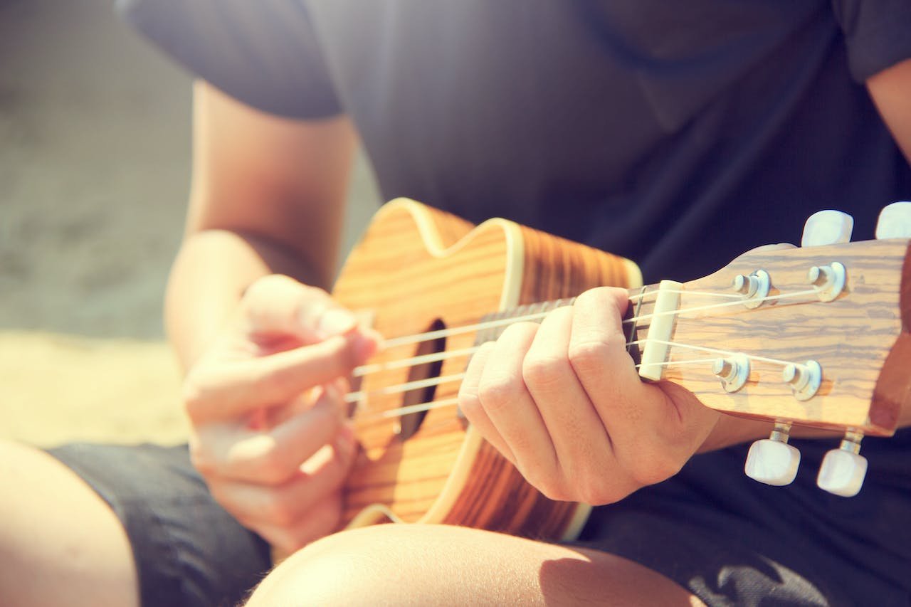 A musician playing an ukulele