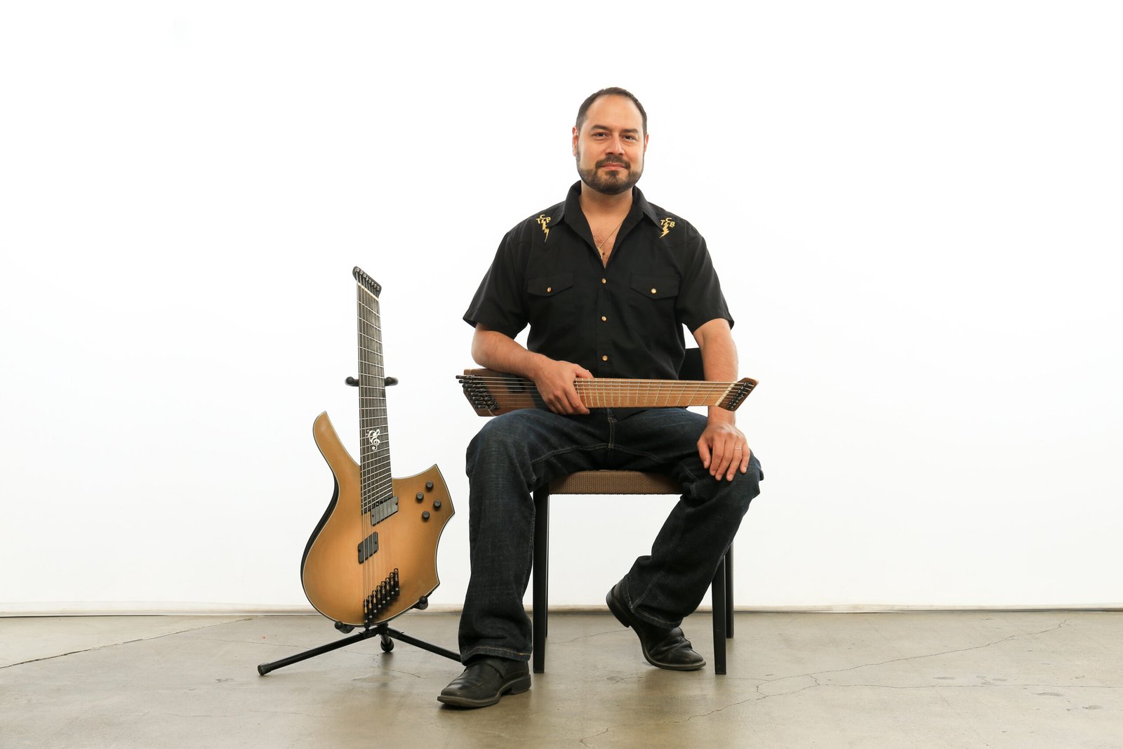 Photo of Nate Lopez, 8-string hybrid bass-guitarist