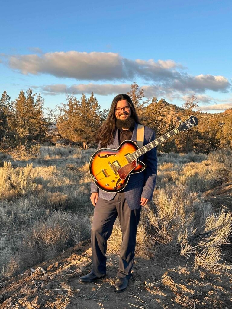 Photo of jazz guitarist Brogan Woodburn at Barnes Butte in Prineville, Oregon